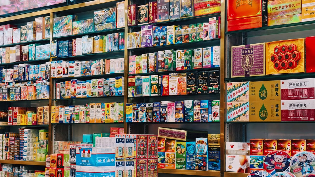 Bright and colorful display of various Asian products on supermarket shelves.