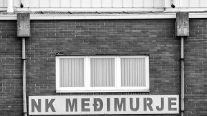 A black and white photo of a brick building